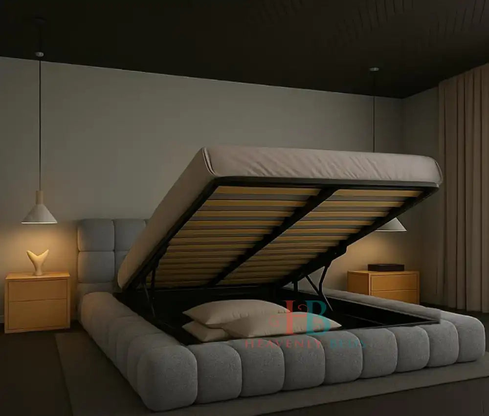 Modern grey teddy fabric bubble bed frame with padded headboard and gas lift storage, styled in a minimal bedroom with wooden nightstands and pendant lighting with metal gas lift open